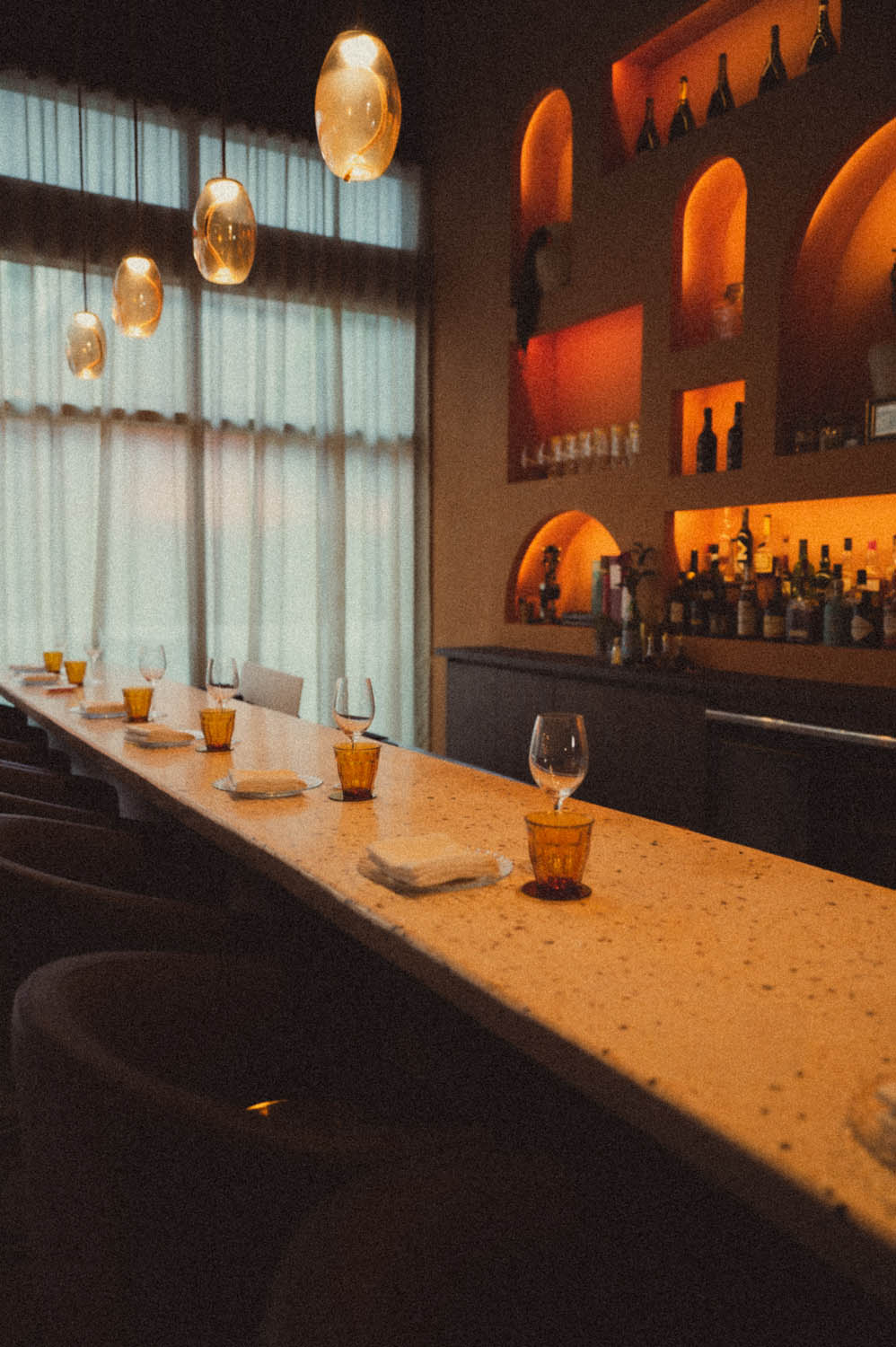 The bar counter set with amber glasses