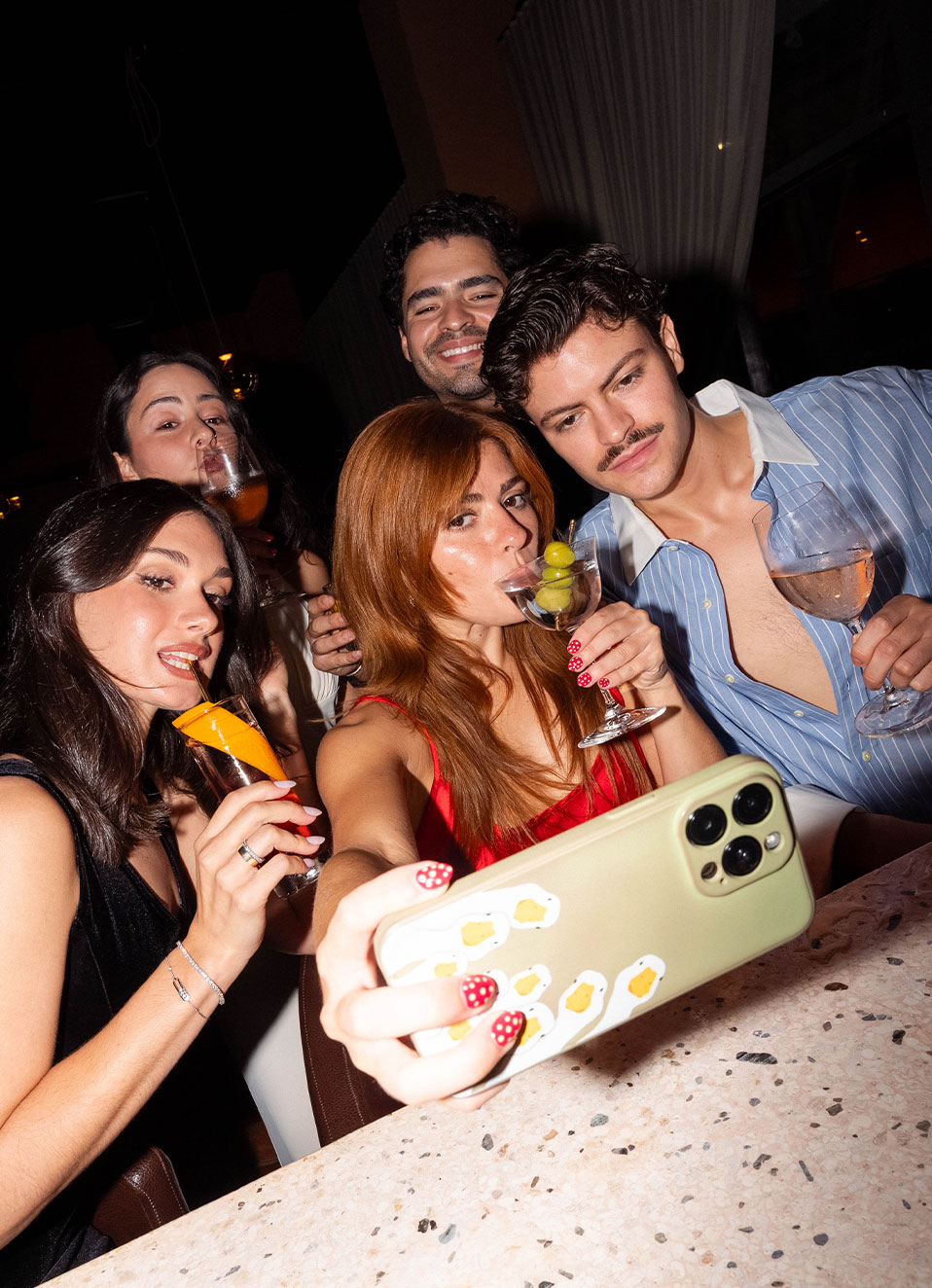 Friends capturing the moment mid-celebration